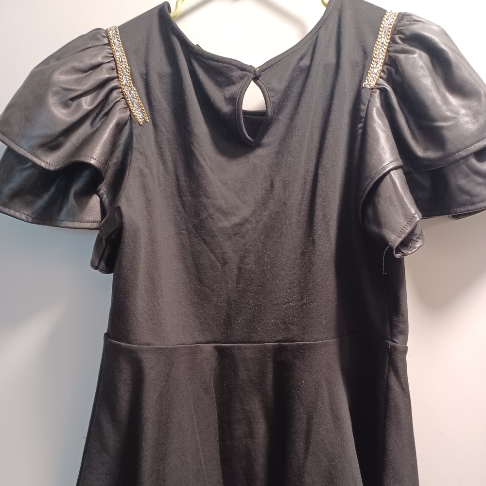 PEPLUM TOP WITH FAUX LEATHER SLEEVES & GILD BLING